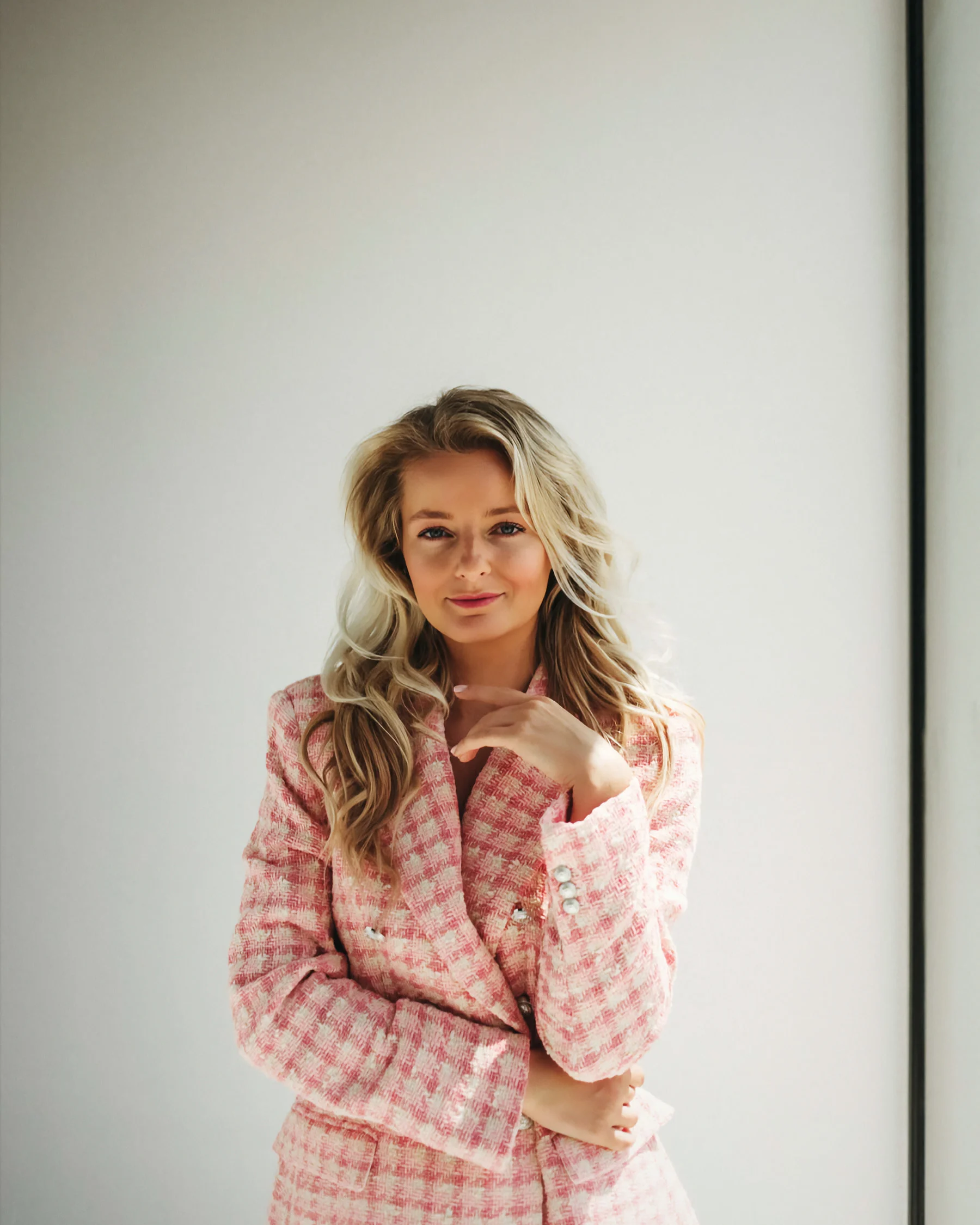 Veronika Bogarova Matta in a blush tweed blazer, studio portrait